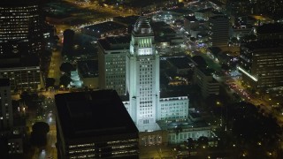 AX64_0368E - 5K aerial stock footage of Los Angeles City Hall at night, Downtown Los Angeles, California