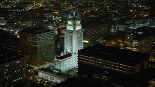 AX64_0369 - 5K aerial stock footage orbit Los Angeles City Hall at night, Downtown Los Angeles, California