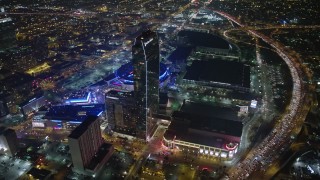 AX64_0374E - 5K aerial stock footage of 777 Tower, Staples Center, and The Ritz-Carlton Hotel, Downtown Los Angeles, California, night