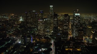 AX64_0381 - 5K aerial stock footage approach US Bank Tower and Downtown Los Angeles skyscrapers, California, night