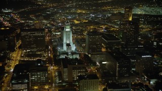 AX64_0384 - 5K aerial stock footage of passing Los Angeles City Hall, Downtown Los Angeles, California, night
