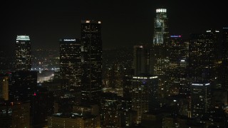 AX64_0391 - 5K aerial stock footage approach Aon Center in Downtown Los Angeles, California, night
