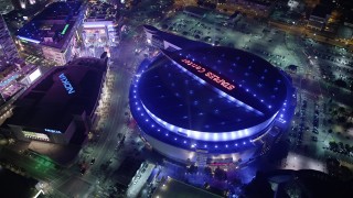 AX64_0407 - 5K aerial stock footage of Nokia Theater and Staples Center arena in Downtown Los Angeles, California, night