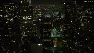 AX64_0412 - 5K aerial stock footage flyby a group of Downtown Los Angeles skyscrapers, California, night