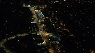 AX64_0419 - 5K aerial stock footage of strip mall on Glendale Boulevard at night, Silverlake, Los Angeles, California