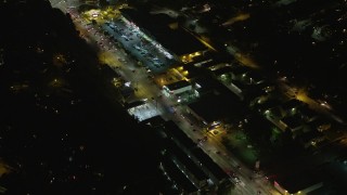 AX64_0419E - 5K aerial stock footage of strip mall on Glendale Boulevard at night, Silverlake, Los Angeles, California