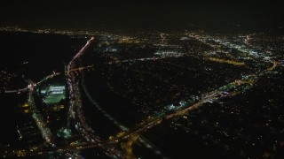AX64_0421 - 5K aerial stock footage of Interstate 5 and Atwater Village neighborhoods, Los Angeles, California, night