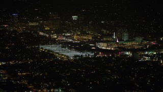 AX64_0423 - 5K aerial stock footage of a view of the Glendale Galleria shopping mall at night in California