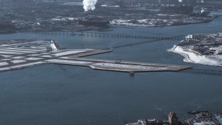 AX66_0044 - 4.8K aerial stock footage of an airliner landing at LaGuardia Airport, New York