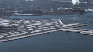 AX66_0045 - 4.8K aerial stock footage of a jet landing at LaGuardia Airport, New York