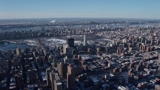 AX66_0057 - 4.8K aerial stock footage of hospital buildings and city sprawl on Upper East Side, New York City