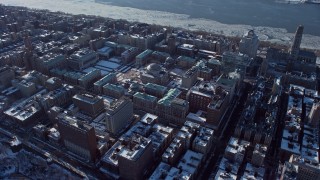 AX66_0062 - 4.8K aerial stock footage orbit the Columbia University campus with snow, New York City