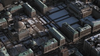 AX66_0067 - 4.8K aerial stock footage of library on Columbia University campus with snow, New York City