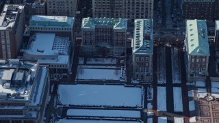 AX66_0070E - 4.8K aerial stock footage of Columbia University Graduate School of Journalism with snow, New York City