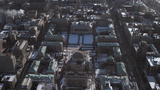 AX66_0076 - 4.8K aerial stock footage orbit around the Columbia University campus with snow, New York City