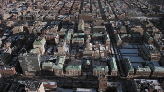 AX66_0082 - 4.8K aerial stock footage of orbiting the snowy campus of Columbia University, Morningside Heights, New York City