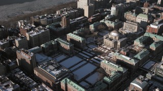 AX66_0094 - 4.8K aerial stock footage of Columbia University campus with snow, New York City