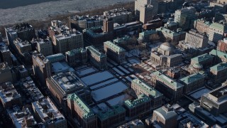 AX66_0094E - 4.8K aerial stock footage of Columbia University campus with snow, New York City