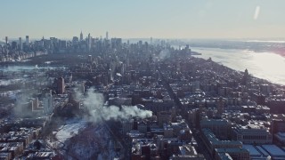 AX66_0097 - 4.8K aerial stock footage orbit Columbia University campus and tilt to reveal Midtown, New York City