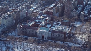 AX66_0106 - 4.8K aerial stock footage of Museum of Natural History with snow, New York City