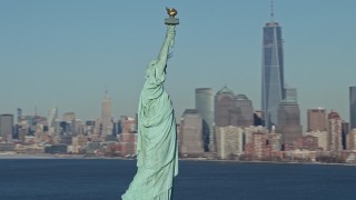 AX66_0130E - 4.8K aerial stock footage of orbiting the famous Statue of Liberty on New York Harbor, New York