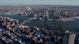 AX66_0141E - 4.8K aerial stock footage orbit the Brooklyn Bridge and Manhattan Bridge, New York City