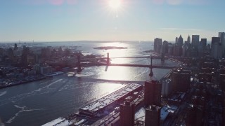 AX66_0144 - 4.8K aerial stock footage of the Manhattan Bridge and Lower Manhattan skyline, New York City