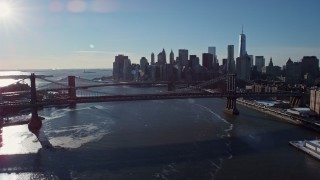AX66_0145E - 4.8K aerial stock footage of the Manhattan Bridge and Lower Manhattan skyline, New York City