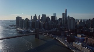 AX66_0148E - 4.8K aerial stock footage approach Lower Manhattan skyline and Brooklyn Bridge, New York City