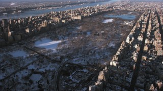 AX66_0188 - 4.8K stock footage aerial video of Central Park in snow, New York City