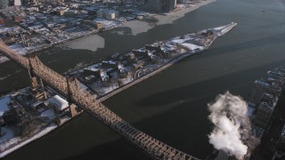 AX66_0217 - 4.8K aerial stock footage of the Goldwater Specialty Hospital on Roosevelt Island with snow, East River, New York