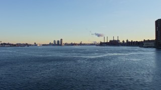 AX66_0225 - 4.8K aerial stock footage of the Williamsburg Bridge on East River in winter, New York City, Sunset