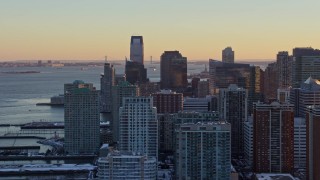 AX66_0246E - 4.8K aerial stock footage of Downtown Jersey City skyscrapers, New Jersey, sunset
