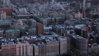 AX66_0281 - 4.8K aerial stock footage of the snowy Columbia University campus in winter, New York City, twilight