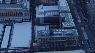 AX66_0287E - 4.8K aerial stock footage tilt from Midtown skyline, reveal Columbia University in winter, New York City, twilight