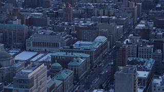 AX66_0292 - 4.8K aerial stock footage of Midtown skyline, tilt to Columbia University in winter, New York City, twilight