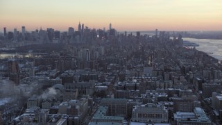 AX66_0293 - 4.8K aerial stock footage tilt from Midtown to reveal Columbia University in winter, New York City, twilight