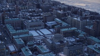 AX66_0293E - 4.8K aerial stock footage tilt from Midtown to reveal Columbia University in winter, New York City, twilight