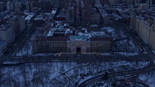 AX66_0302E - 4.8K aerial stock footage of the Museum of Natural History in winter, New York City, twilight