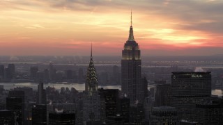 AX66_0312 - 4.8K aerial stock footage of famous Empire State Building and Chrysler Building in winter, New York City, twilight