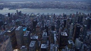 AX66_0329 - 4.8K aerial stock footage of Hell's Kitchen, Midtown Manhattan in winter, New York City, twilight