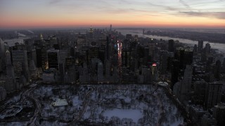 AX66_0334 - 4.8K aerial stock footage approach Times Square and Midtown Manhattan in winter, New York City, twilight