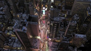 AX66_0349 - 4.8K aerial stock footage of an orbit of Times Square in winter, New York City, twilight