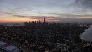 AX66_0357 - 4.8K aerial stock footage of Lower Manhattan and East Village in winter, New York City, twilight