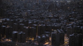 AX66_0358 - 4.8K aerial stock footage of East Village apartment buildings in winter, New York City, twilight