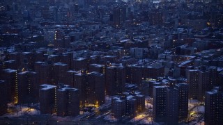AX66_0358E - 4.8K aerial stock footage of East Village apartment buildings in winter, New York City, twilight