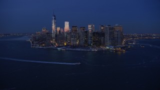 AX66_0376 - 4.8K stock footage aerial video of Lower Manhattan skyline in winter, New York City, twilight