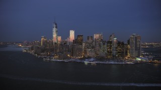 AX66_0377 - 4.8K stock footage aerial video of the Lower Manhattan skyline and Battery Park in winter, New York City, twilight