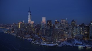 AX66_0377E - 4.8K aerial stock footage of One World Trade Center and Lower Manhattan in winter, New York City, twilight