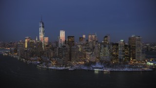 AX66_0378 - 4.8K stock footage aerial video of One World Trade Center and Lower Manhattan in winter, New York City, twilight